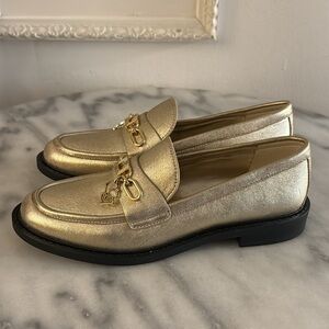 BRAND NEW KL pale gold moccasins w/ gold Karl’s charm SZ 6